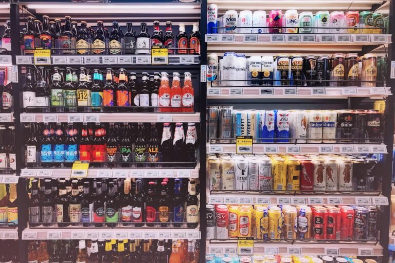 Supermarket beer shelf showing product placement as an example of Place in the 4Ps of marketing program, highlighting how distribution and availability influence consumer choice.