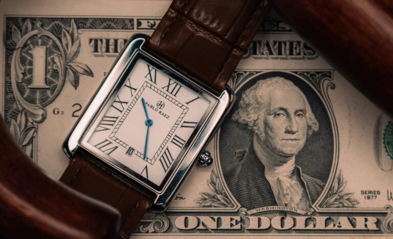 Wristwatch on top of a US one-dollar bill symbolizing the time value of money in finance